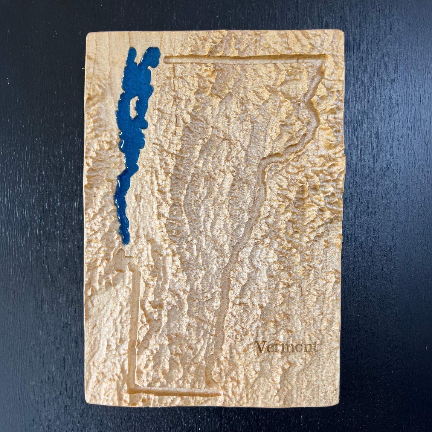 Vermont State map carved in wood with Lake Champlain feature in blue epoxy