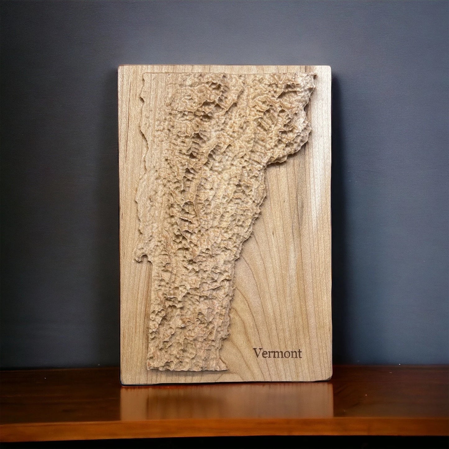 Vermont State map carved in wood with topographic 3D detail.