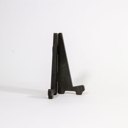 Black map stand fitted together with legs facing right