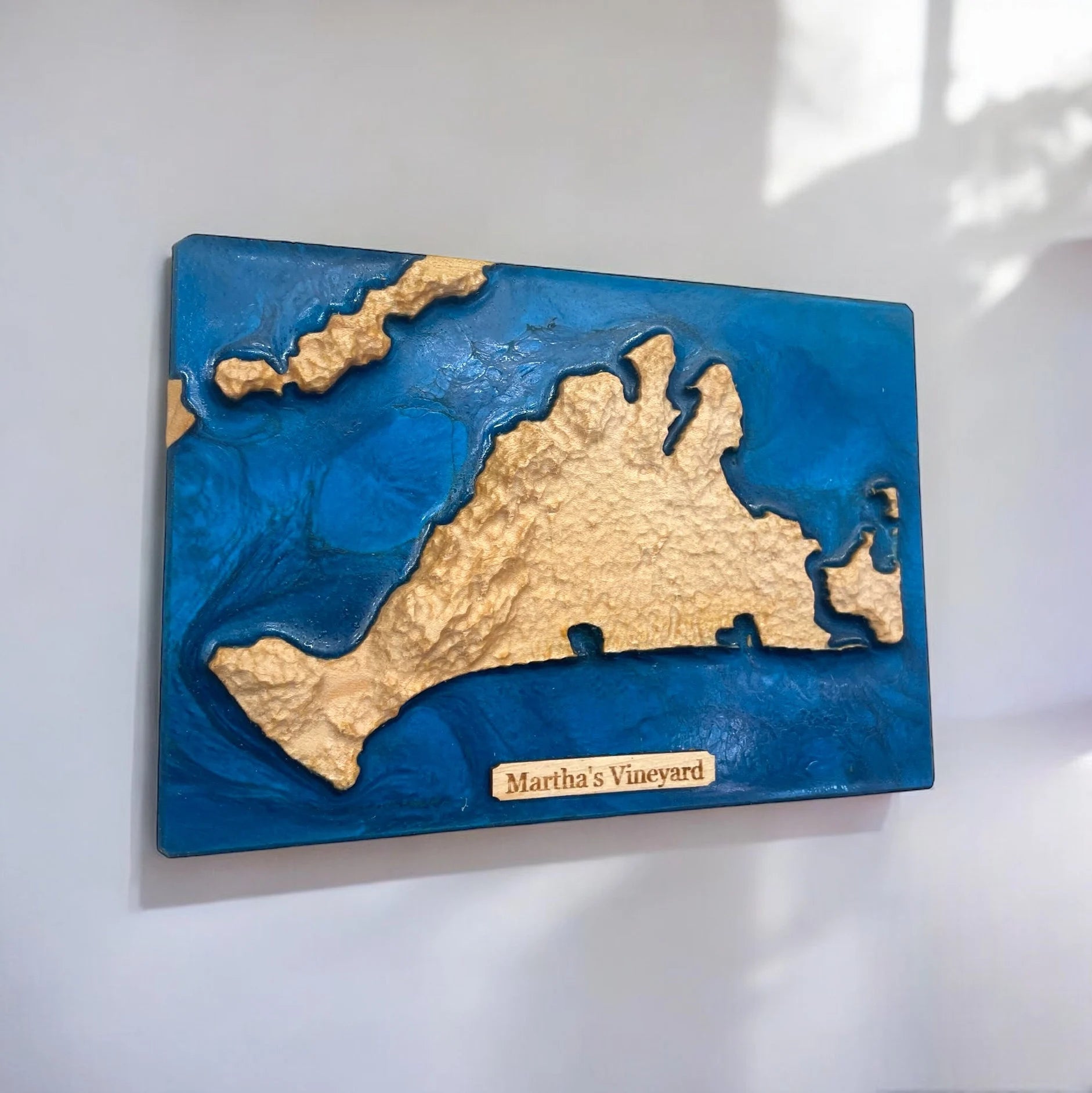 Topographical Map of Martha's Vineyard with blue epoxy water features on a white wall