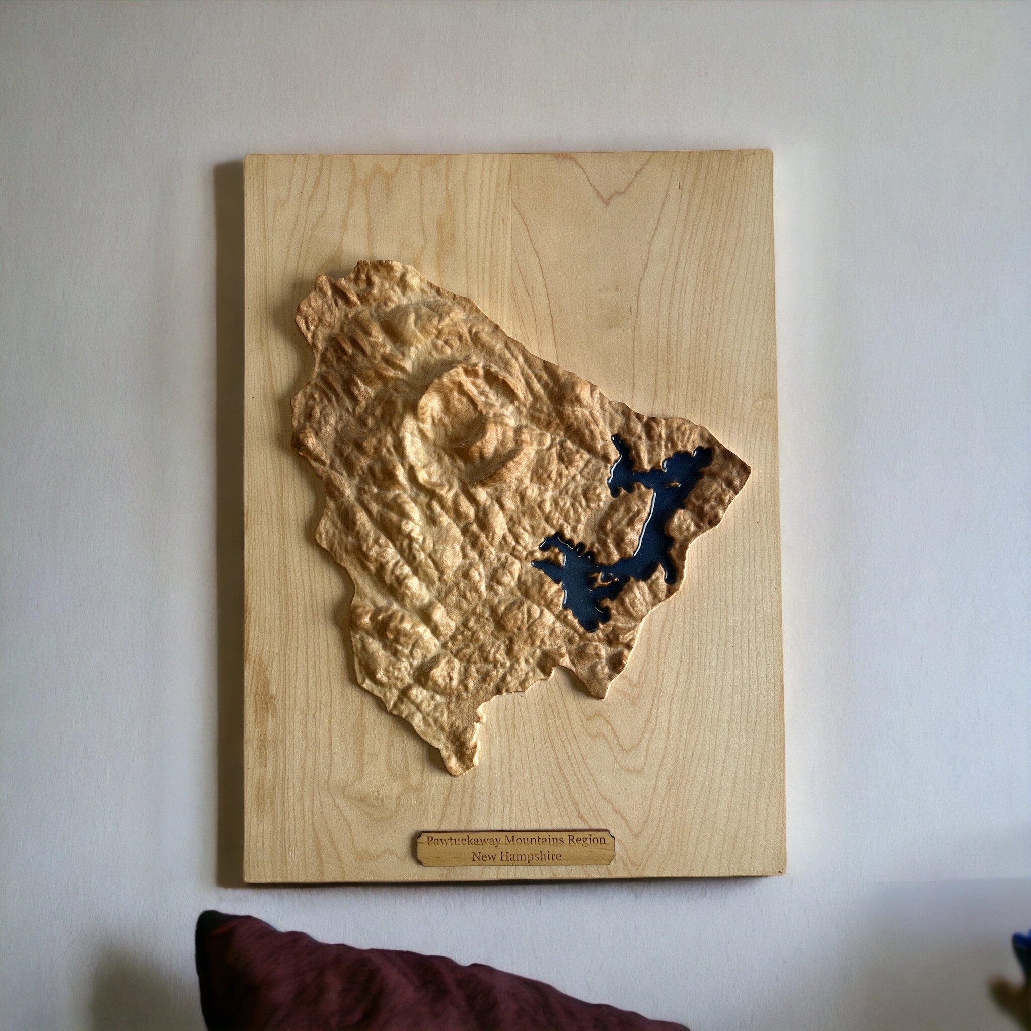 Pawtuckaway State Park and lake topo wooden map with lake hanging on a white wall
