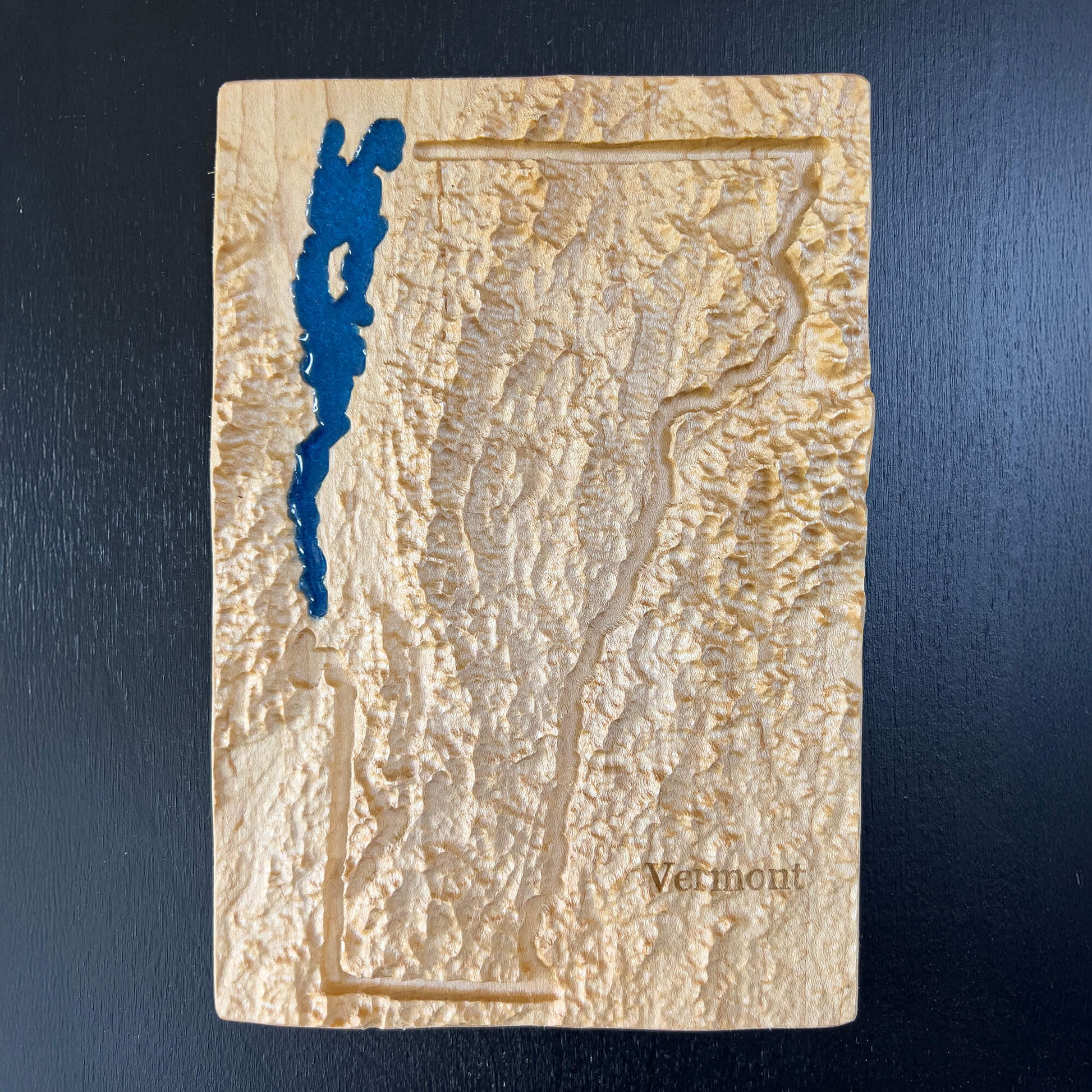 Vermont State map carved in wood with Lake Champlain feature in blue epoxy