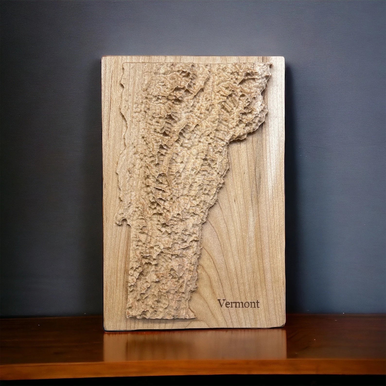 Vermont State map carved in wood with topographic 3D detail.