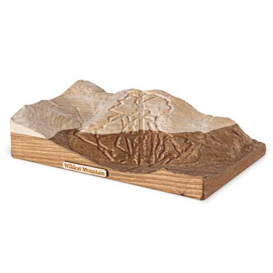 Wooden model of a mountain range with 'Wildcat Mountain' branding on a white background