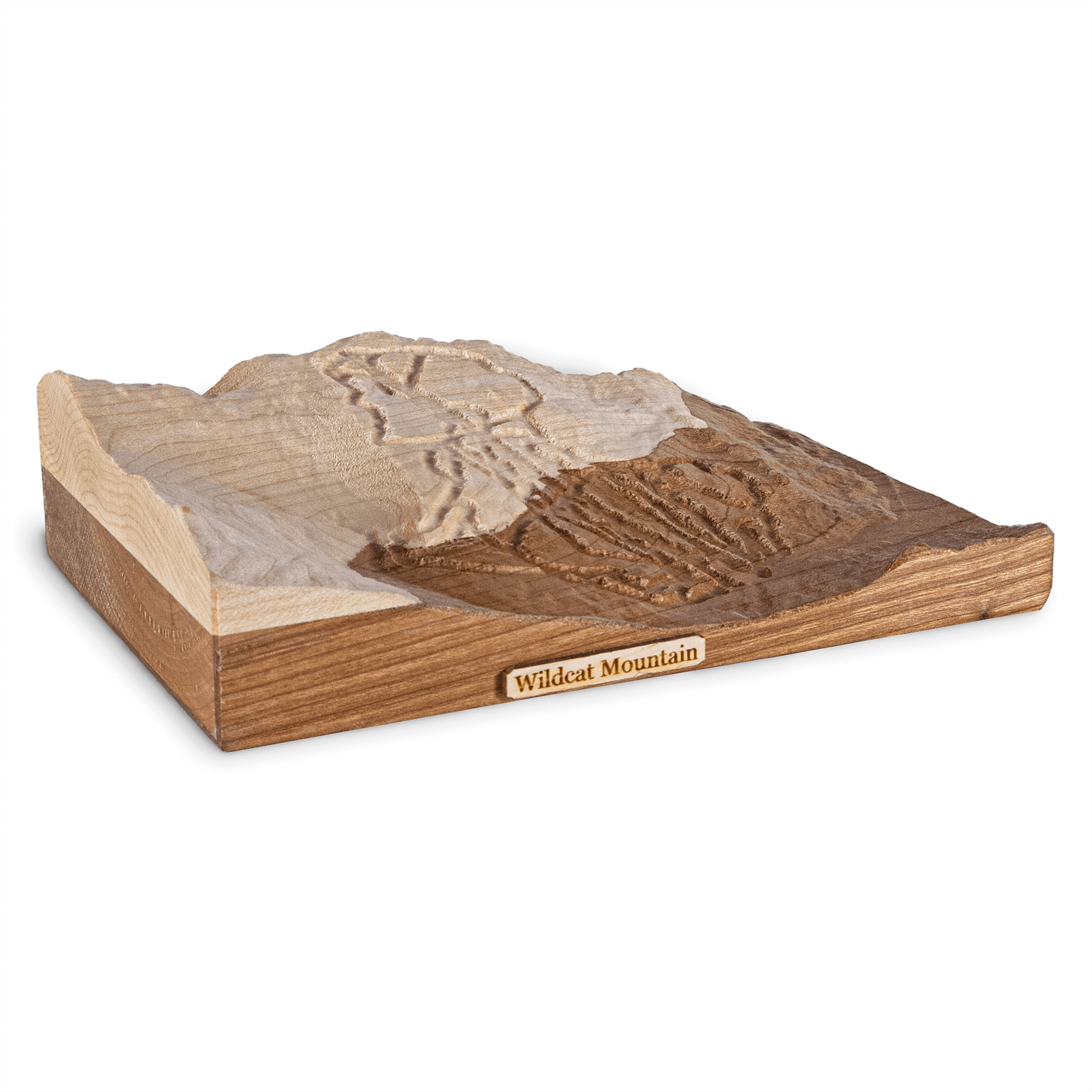 Wooden model of a mountain landscape with 'Wildcat Ski Mountain' plaque on a white background