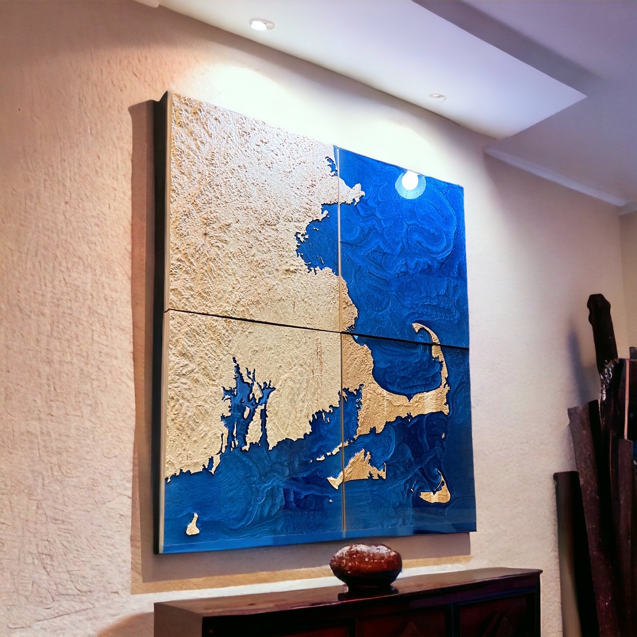 large map of cape cod with blue epoxy depicting water on a textured wall