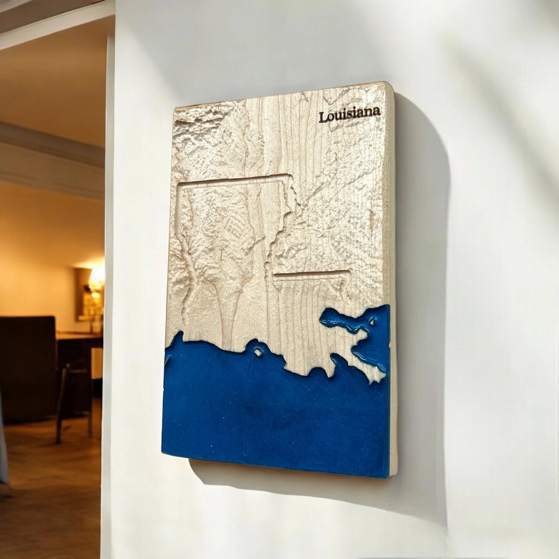 3D map of Louisiana on a wall with blue water detail