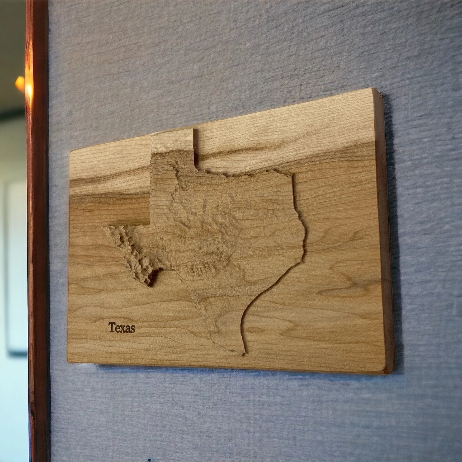 topographic Wooden wall art of Texas on a gray wall