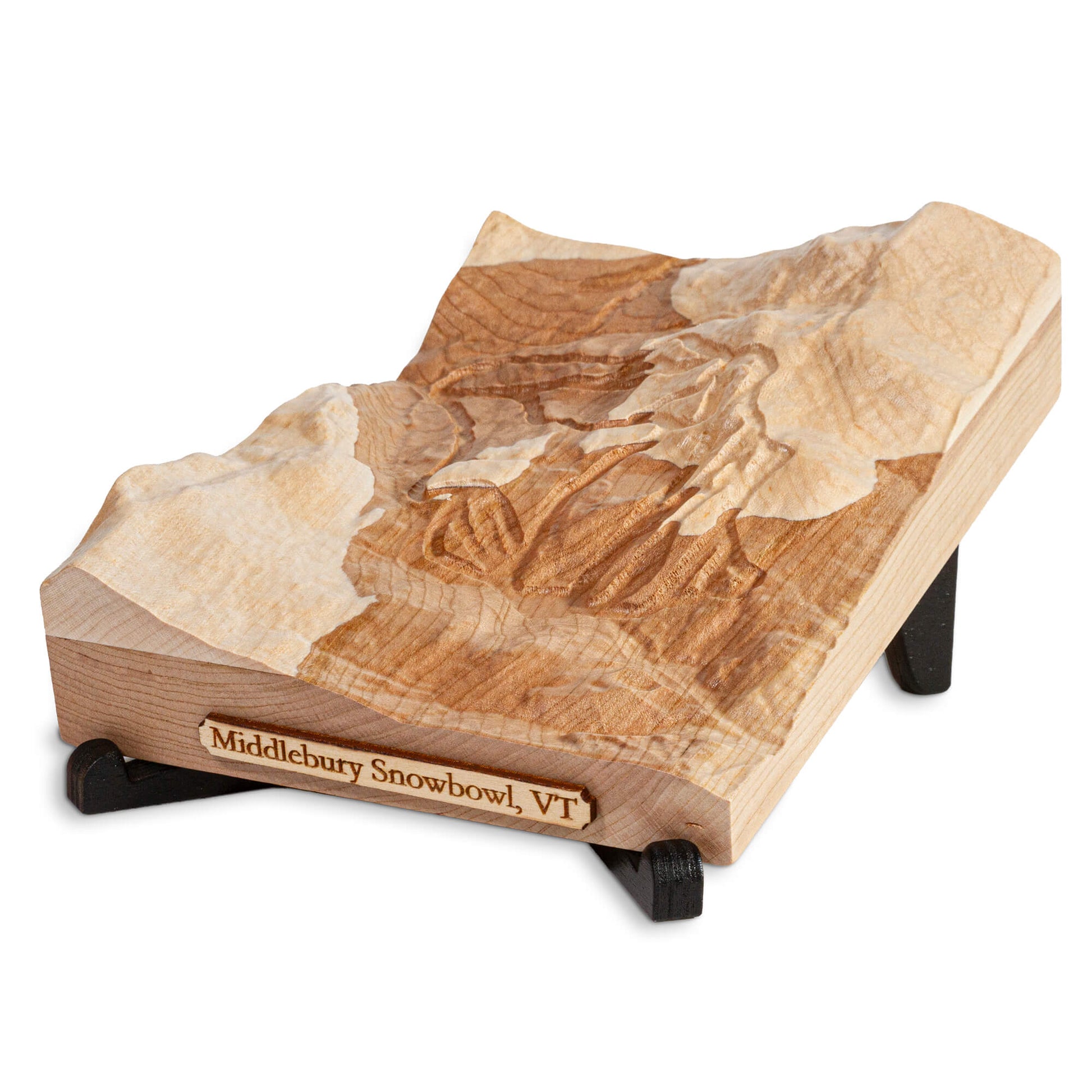 carved wooden map of a ski resort sitting on a black laser cut display stand