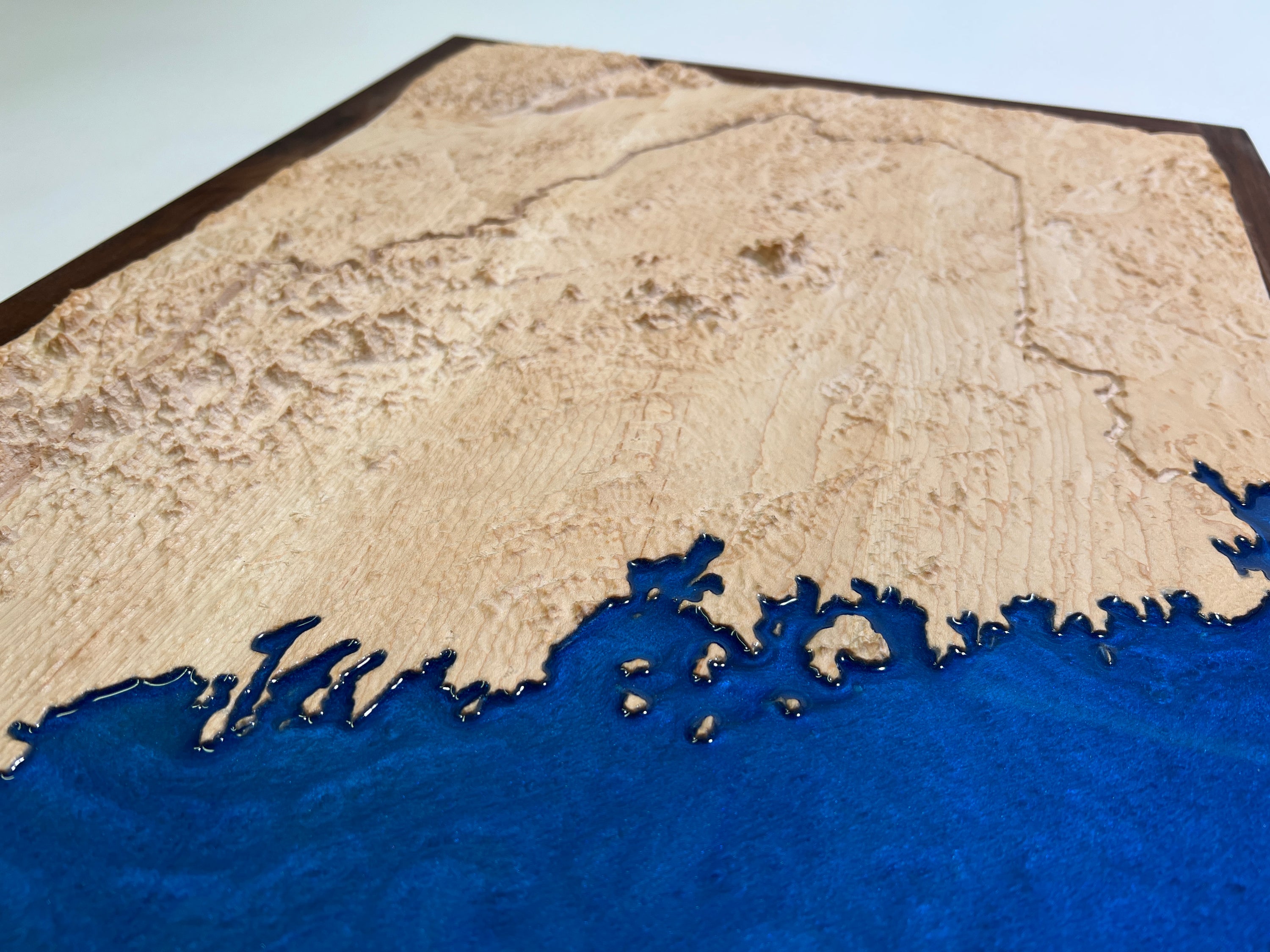 map of state of maine topographic map carved from wood with blue epoxy for water
