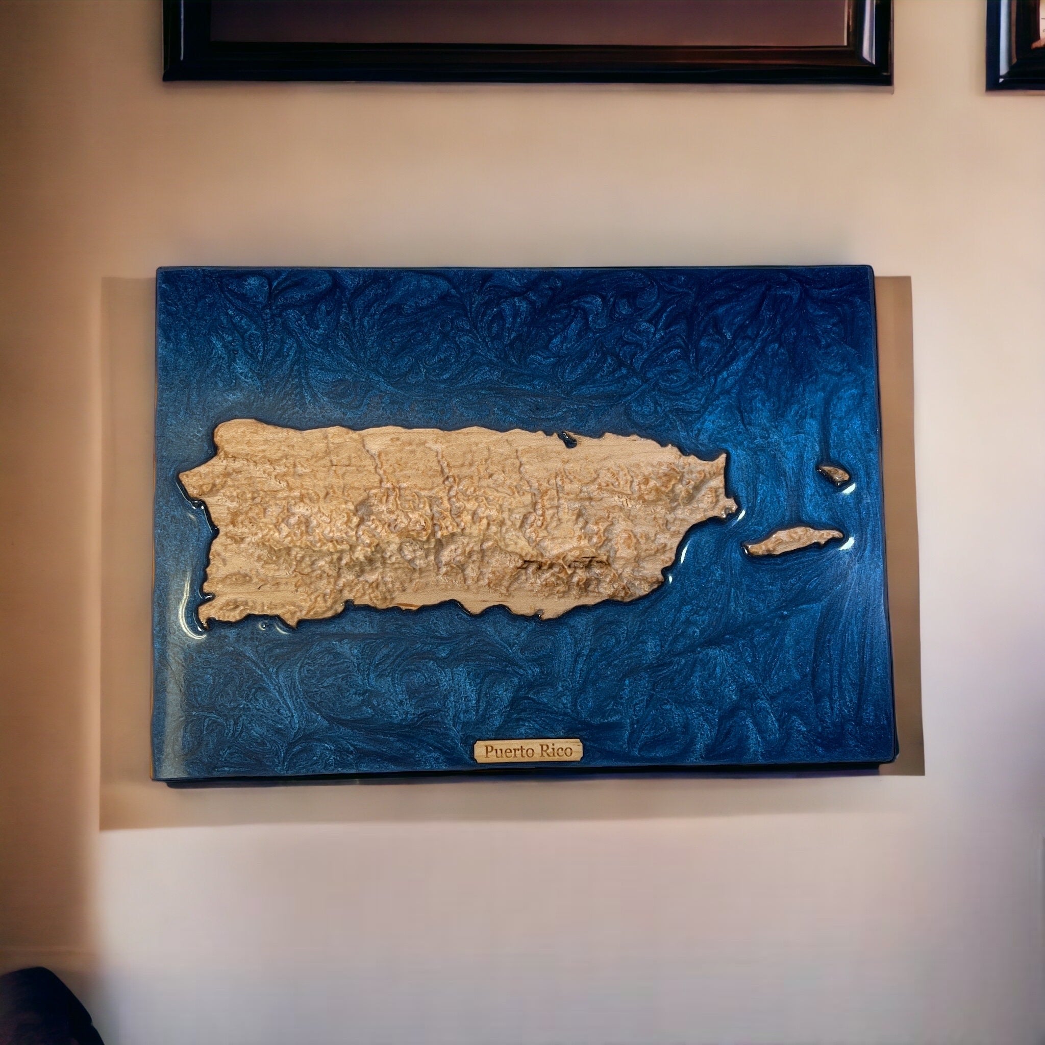 puerto rico 3d wooden carved topo map and blue epoxy hanging on the wall